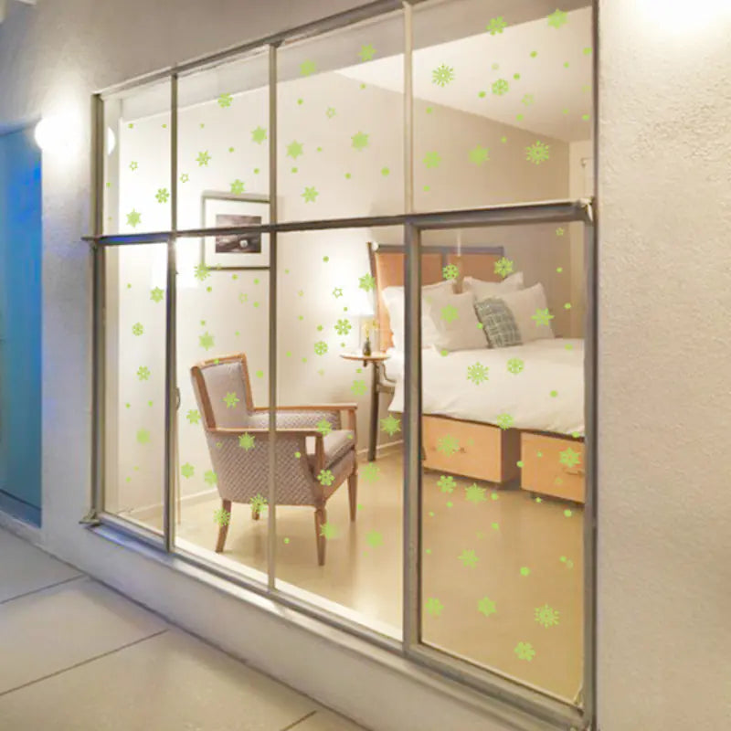 Pegatinas de pared de copos de nieve que brillan en la oscuridad para niños