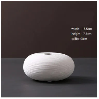 Jarrón minimalista de cerámica blanca
